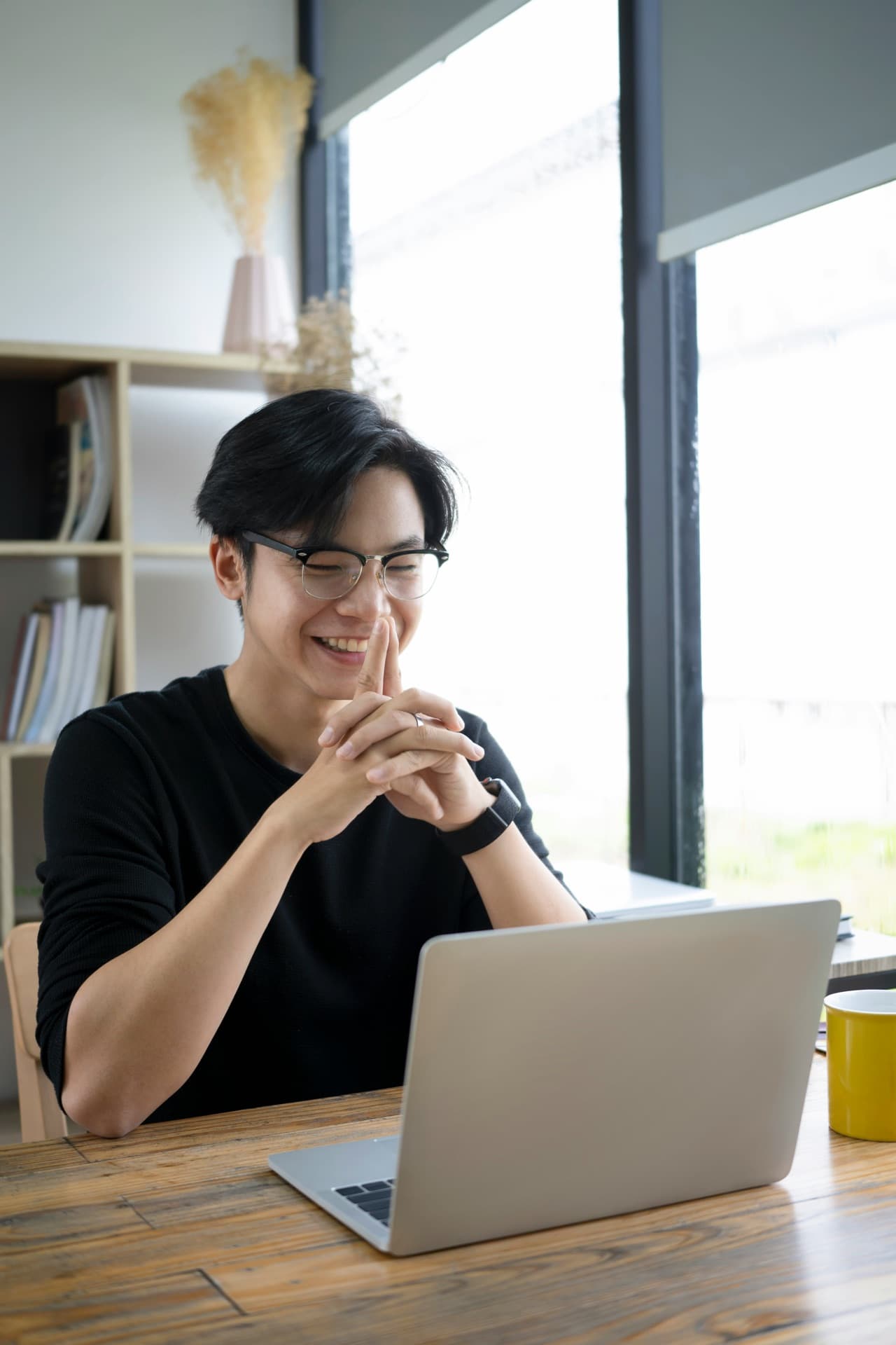 A smiling student enjoying a relaxed video language lesson
